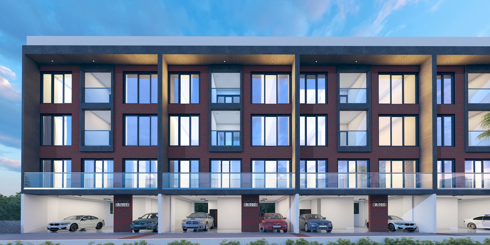 Destination 12 Gems illuminated at night — elegant brick-and-glass facade